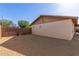 Side yard with privacy fence, exterior of home, and low maintenance landscaping at 1002 W Villa Rita Dr, Phoenix, AZ 85023
