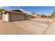A two-car garage featuring neutral paint and driveway at 1002 W Villa Rita Dr, Phoenix, AZ 85023