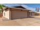 Garage door featuring neutral paint and concrete driveway at 1002 W Villa Rita Dr, Phoenix, AZ 85023