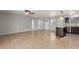 Spacious living room with tile flooring, a ceiling fan, and light gray walls at 1002 W Villa Rita Dr, Phoenix, AZ 85023