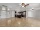 Open-concept living room featuring tile flooring, modern lighting, and kitchen views at 1002 W Villa Rita Dr, Phoenix, AZ 85023