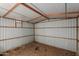 Interior view of storage shed with wood framing and corrugated metal walls at 1002 W Villa Rita Dr, Phoenix, AZ 85023