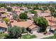 Charming single-story homes with tile roofs, lush landscaping, and mature trees nestled in a desirable neighborhood setting at 1226 E Greenway Cir, Mesa, AZ 85203