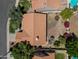 An aerial view showcases this home's sprawling roof and landscaping in a friendly neighborhood at 1226 E Greenway Cir, Mesa, AZ 85203