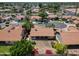 The house has a nice roof and backyard with lush green trees at 1226 E Greenway Cir, Mesa, AZ 85203