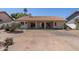 Wide view of backyard featuring desert landscaping and tile roof at 1226 E Greenway Cir, Mesa, AZ 85203