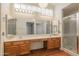 The bathroom features dual sinks, vanity lighting, and a glass shower enclosure at 1226 E Greenway Cir, Mesa, AZ 85203