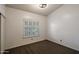 Cozy bedroom featuring plush carpeting and a shuttered window for natural light at 1226 E Greenway Cir, Mesa, AZ 85203