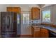 The kitchen features stainless steel appliances and granite countertops with a door to the outside at 1226 E Greenway Cir, Mesa, AZ 85203