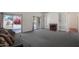 Cozy living room with a fireplace, built-in shelves, and sliding glass doors to the backyard at 1226 E Greenway Cir, Mesa, AZ 85203