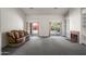 Spacious living room featuring a fireplace, built-in shelves, and sliding glass doors at 1226 E Greenway Cir, Mesa, AZ 85203