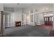 Open-concept living area with built-in shelving, fireplace, and abundant natural light at 1226 E Greenway Cir, Mesa, AZ 85203