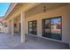 Covered patio featuring support columns and sliding glass doors at 1226 E Greenway Cir, Mesa, AZ 85203