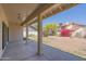 A covered patio offers shade and comfort while enjoying the backyard views at 1226 E Greenway Cir, Mesa, AZ 85203