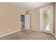 Bedroom featuring neutral walls, carpet, and access to a balcony at 1367 S Country Club Dr # 1299, Mesa, AZ 85210