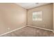 Cozy bedroom featuring neutral walls, carpet flooring, and a window providing natural light at 1367 S Country Club Dr # 1299, Mesa, AZ 85210