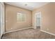 Bedroom featuring neutral walls, carpet, a bright window, and access to a walk-in closet at 1367 S Country Club Dr # 1299, Mesa, AZ 85210