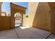 Private gated courtyard with arched entry, providing a tranquil outdoor space at 1367 S Country Club Dr # 1299, Mesa, AZ 85210