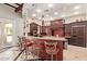Stylish kitchen island with unique mosaic design, pendant lighting, and seating for casual dining at 1367 S Country Club Dr # 1299, Mesa, AZ 85210