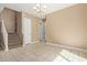 Spacious living room featuring bright tile floors, stairs, and chandelier at 1367 S Country Club Dr # 1299, Mesa, AZ 85210