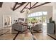 Bright living room boasts vaulted ceilings with exposed beams and large windows for natural light at 1367 S Country Club Dr # 1299, Mesa, AZ 85210