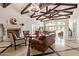 Spacious living room with vaulted ceilings, stone fireplace, and ample natural light at 1367 S Country Club Dr # 1299, Mesa, AZ 85210