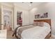 Cozy bedroom features neutral decor, a comfortable bed, and ensuite access to a bathroom and hallway at 1508 N Alta Mesa Dr # 120, Mesa, AZ 85205