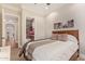 Cozy bedroom features neutral decor, a comfortable bed, and ensuite access to a bathroom and hallway at 1508 N Alta Mesa Dr # 120, Mesa, AZ 85205