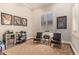 Bonus room featuring seating, media and refreshment center, hardwood floors and shuttered windows at 1508 N Alta Mesa Dr # 120, Mesa, AZ 85205