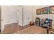 Bonus room with hardwood floors, an open floor plan, and abundant storage with multiple doors at 1508 N Alta Mesa Dr # 120, Mesa, AZ 85205