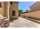 Home's private back courtyard featuring stone pavers and a built-in planter at 1508 N Alta Mesa Dr # 120, Mesa, AZ 85205