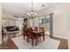 Bright dining room with a dining table, chairs, and sliding glass door with backyard access at 1508 N Alta Mesa Dr # 120, Mesa, AZ 85205