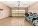 Spacious two-car garage with ample room for parking and storage, plus a motorcycle on display at 1508 N Alta Mesa Dr # 120, Mesa, AZ 85205