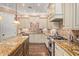Stylish kitchen with granite countertops, tile backsplash, and stainless steel appliances at 1508 N Alta Mesa Dr # 120, Mesa, AZ 85205