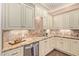 Well-lit kitchen featuring custom cabinets, granite countertops, and stainless appliances at 1508 N Alta Mesa Dr # 120, Mesa, AZ 85205