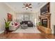 Spacious living room featuring hardwood floors, a fireplace, and ample seating at 1508 N Alta Mesa Dr # 120, Mesa, AZ 85205