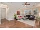 Open-concept living room showcasing hardwood floors and access to other rooms at 1508 N Alta Mesa Dr # 120, Mesa, AZ 85205