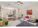 Open living space with hardwood floors, chandelier, and a view into the dining room at 1508 N Alta Mesa Dr # 120, Mesa, AZ 85205
