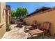 Outdoor patio boasting a built-in kitchen, lounge chairs, and dining set for entertaining and relaxing at 1508 N Alta Mesa Dr # 120, Mesa, AZ 85205
