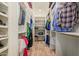A spacious walk-in closet boasts custom shelves and multiple racks for shoes, clothes, and accessories at 1508 N Alta Mesa Dr # 120, Mesa, AZ 85205