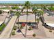 Backyard view featuring desert landscaping and an extended covered patio in a golf community at 15371 W Piccadilly Rd, Goodyear, AZ 85395