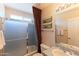 Bathroom with a shower/tub combo, gray tile surround, and matching vanity at 15371 W Piccadilly Rd, Goodyear, AZ 85395
