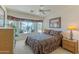 Comfortable bedroom with a large window overlooking the golf course at 15371 W Piccadilly Rd, Goodyear, AZ 85395