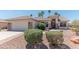 A charming single-story home with stone accents, desert landscaping, and a two-car garage at 15371 W Piccadilly Rd, Goodyear, AZ 85395