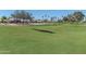 Beautiful view of the well-maintained golf course and surrounding community at 15371 W Piccadilly Rd, Goodyear, AZ 85395