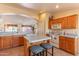 Functional kitchen with an island and breakfast bar open to living spaces at 15371 W Piccadilly Rd, Goodyear, AZ 85395