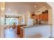 A kitchen with an island and breakfast nook at 15371 W Piccadilly Rd, Goodyear, AZ 85395