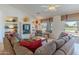 Bright living room with golf course views and built-in shelving, perfect for relaxing at 15371 W Piccadilly Rd, Goodyear, AZ 85395