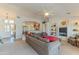 A spacious living room with vaulted ceilings and built-in shelves perfect for entertaining at 15371 W Piccadilly Rd, Goodyear, AZ 85395