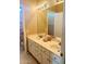 Well-lit bathroom featuring a double sink vanity and a large mirror at 15897 N Gil Balcome St, Surprise, AZ 85374